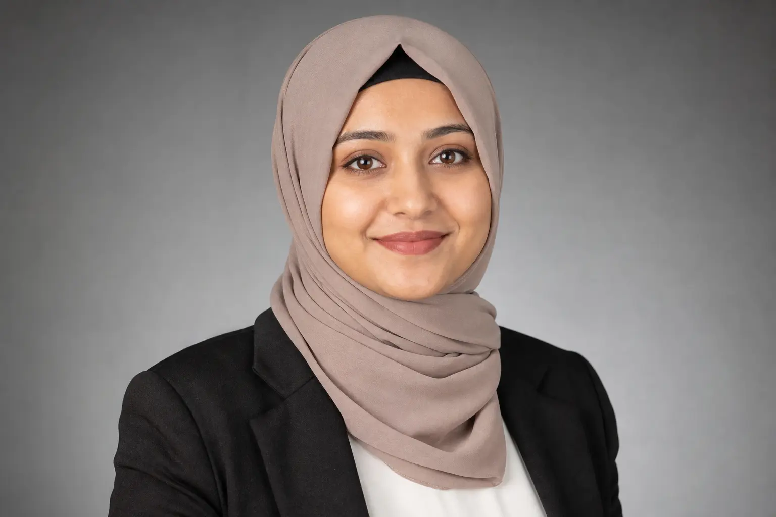 Portrait of Dr. Aisha Rahman, Lead Curriculum Editor